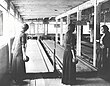 Women bowling in formal attire, probably ca. 1915.