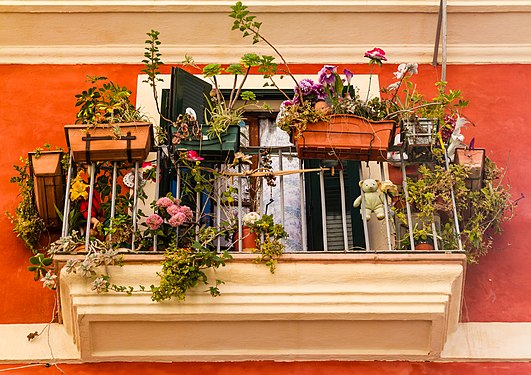 Balcony with flowers and stuffed toys