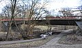 Blick von Nordosten auf die Mellingbekbrücke. Diese quert die Mellingbek und verbindet die Straßen Poppenbütteler Berg in Hamburg-Poppenbüttel und Lemsahler Landstraße in Hamburg-Lemsahl-Mellingstedt.