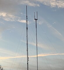 Two large towers, one (right) of which is a candelabra with a goalpost-esque appearance