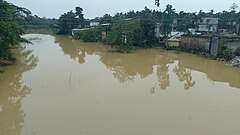 Flooded area along the river bank of the Kachua river at Chargula, Karimganj, Assam.