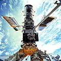 "STS-103_Hubble_EVA.jpg" by User:TheDJ