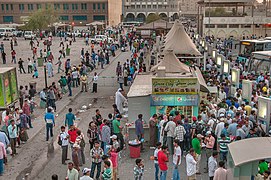 Migrant workers at Al Ghanim Central Bus Station.