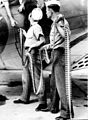 Ordnancemen loading belted cartridges into SBD-3 at NAS Norfolk, Va. September 1942.