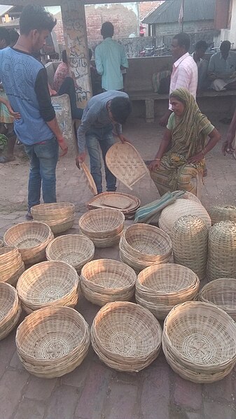 File:A woman selling baskets at Kumirmari Island Bazaar, Sunderbans.jpg