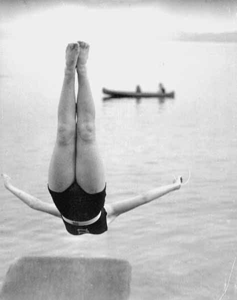 File:Girl in midair during a swan dive into a lake (4498023112).jpg