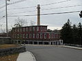 The Capron mill, built by John Capron Sr. and his sons Effingham, and John, circa 1820 manufactured the first satinets, used the first power looms for woolens in America, and made US military uniforms for over 140 years, including the first US Air Force dress uniform, "Uxbridge 1683", aka Uxbridge Blue.