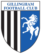 A shield with the words "Gillingham Football Club" in the top portion and the remainder divided into two sections, the left containing black and white vertical stripes and the right a depiction of a white horse rearing up on its hind legs on a blue background