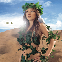 A body shot of a woman (Ayumi Hamasaki) wearing vines and leaves around her body, letting down her brown hair. As she looks towards a distance, a dove sits on her shoulder while standing in front of a desert-like surrounding. The title of the album is superimposed on the image.