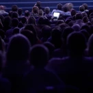 Silhouette of an audience at a conference