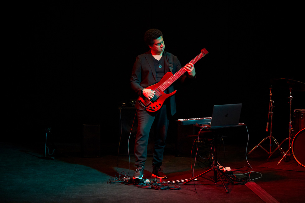 Apple Entrepreneur Camp participant and Jazz musician Matt Garrison plays a guitar.