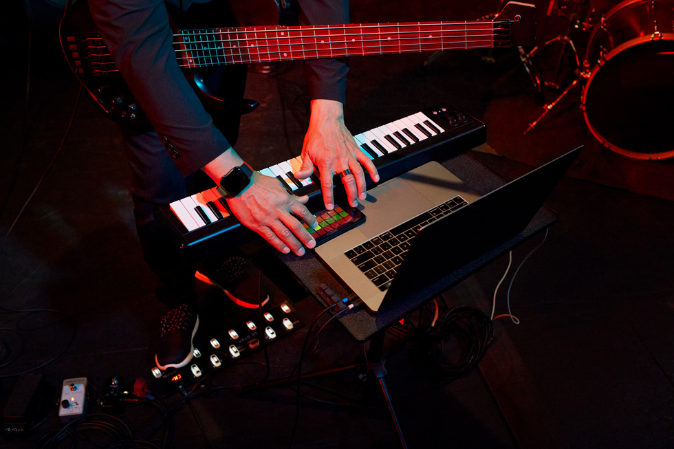 A close-up of Matt Garrison playing a keyboard.