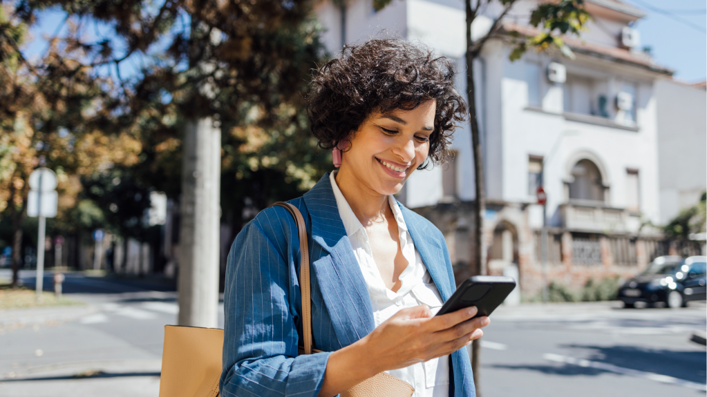 A photo of a woman using her phone.