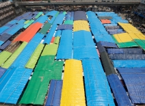 Dhaka, Bangladesh - June 17, 2023: After the massive fire that ravaged the Bangabazar market on April 04, traders set up their shops with these makeshift arrangements under the open sky.