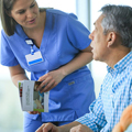 Nurse speaking with cancer support group patient.