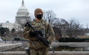 U.S. Army Spc. Kyle Moore with the 46th Military Police Company, 177th Military Police Brigade, Michigan National Guard, provides perimeter security near the U.S. Capitol in Washington, D.C., Feb. 12, 2021. The National Guard has been requested to continue supporting federal law enforcement agencies with security, communications, medical evacuation, logistics, and safety support to state, district and federal agencies through mid-March. (U.S. Army National Guard photo by Capt. Joe Legros)