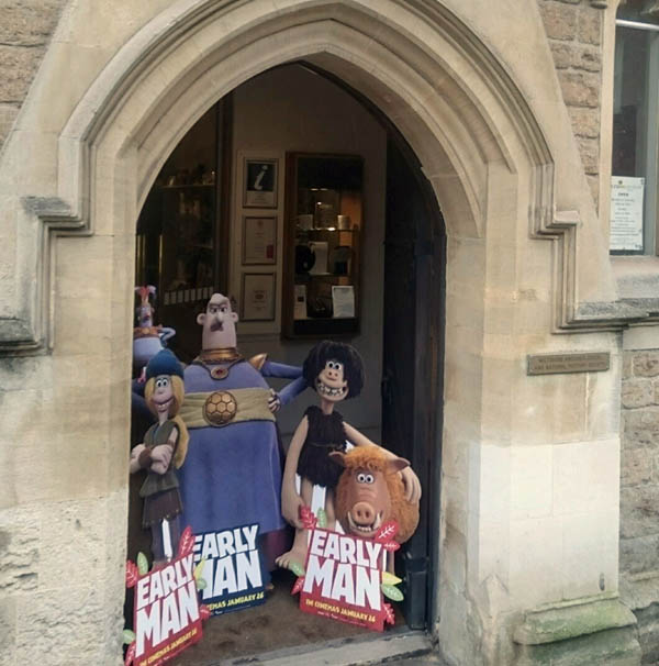 Aardman Early Man cardboard characters in the Wiltshire Museum doorway