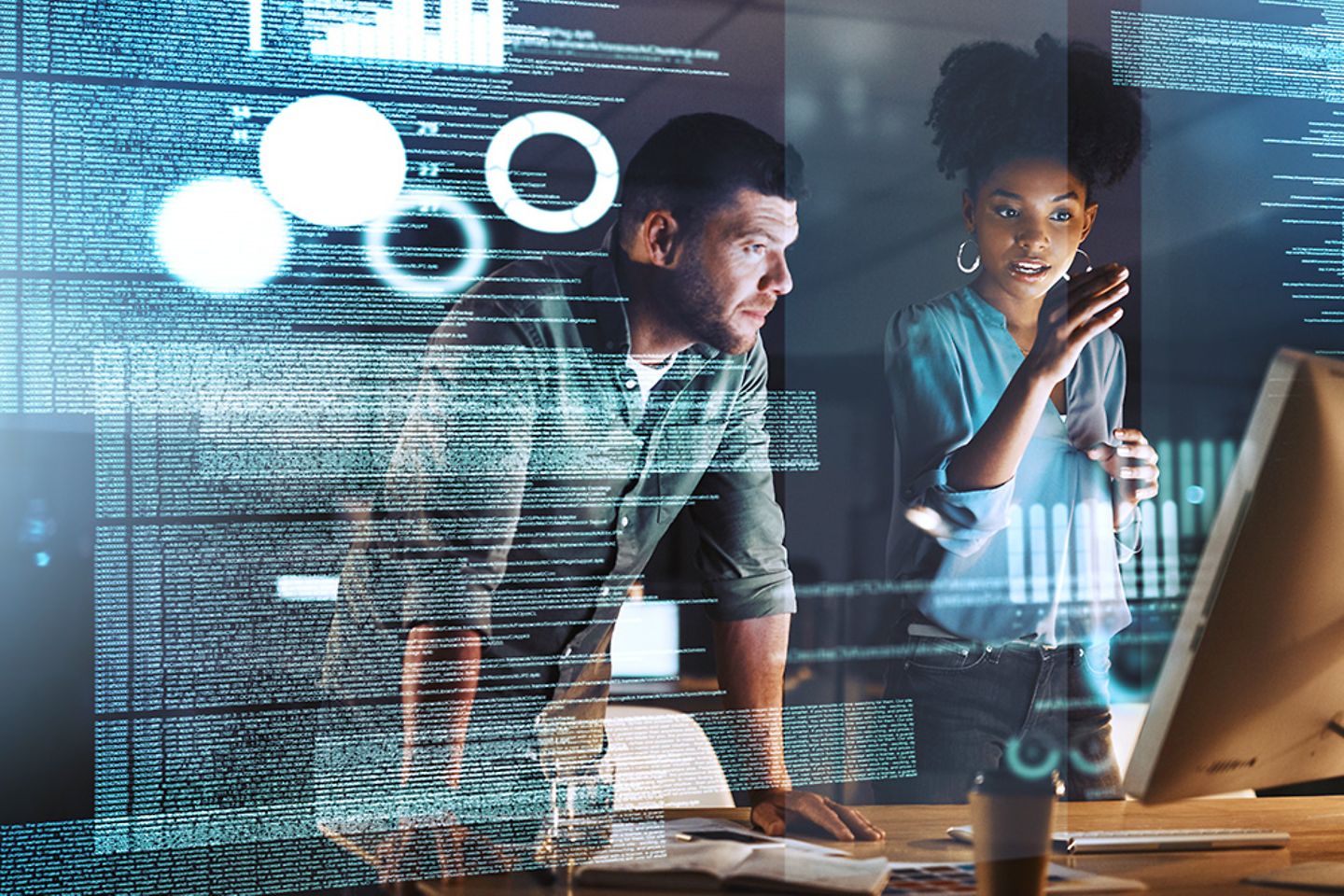 Two AI professionals in front of a screen