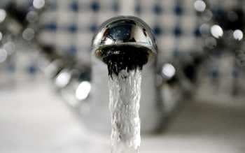 gushing water from a household water tap