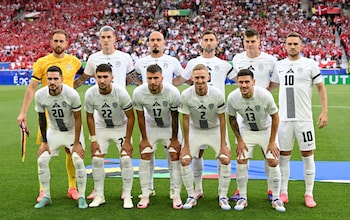 The Slovenia players line up before the kick off.