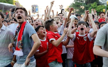 Austria fans celebrate after Austria's Marcel Sabitzer scores their third goal