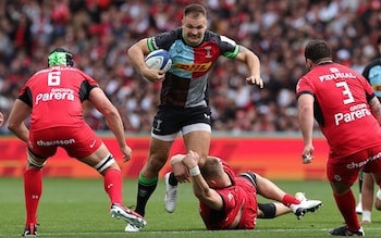 Andre Esterhuizen of Harlequins goes past the challenge of Jack Willis during the Champions Cup Semi Final match against Toulouse