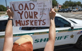 A Donald Trump supporter in Florida protests against the guilty verdict against the former president