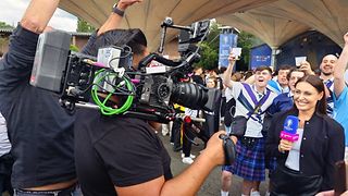 Reporter Kamila Benschop during a live 5G broadcast to MagentaTV from the public viewing area in Cologne.