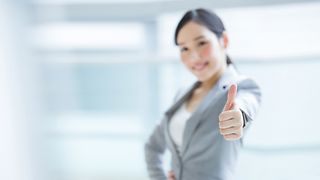 Woman showing "thumbs up".