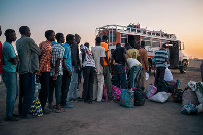 Refugees and returnees from Sudan wait to board a truck to Maban, South Sudan.