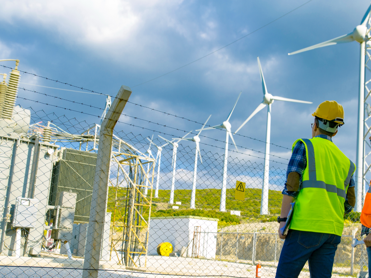 Technicians inspecting wind turbines