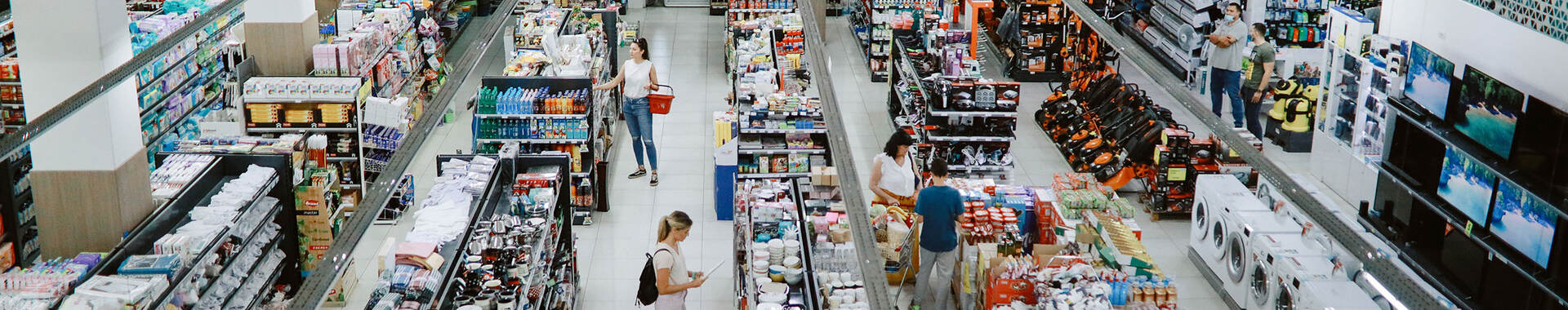 Overhead view of many people shopping in a large supermarket