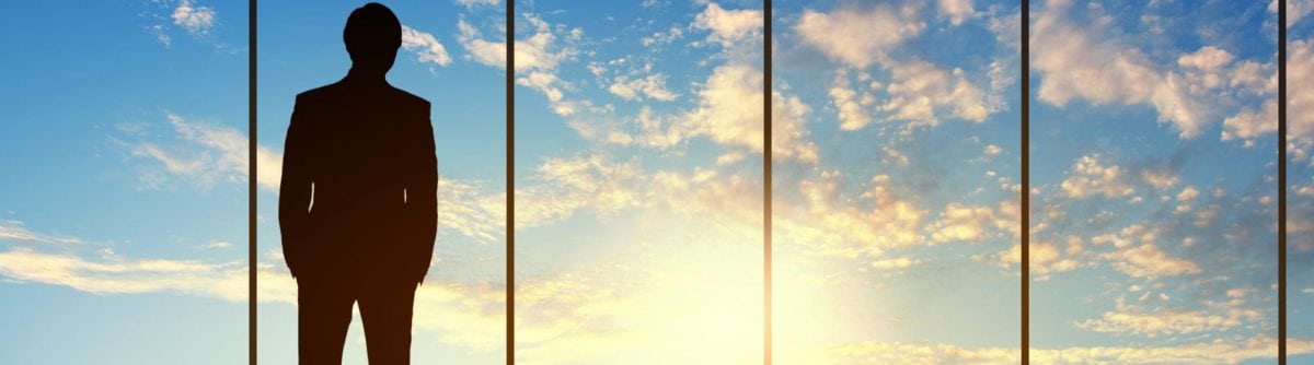 man looking into the sky from office