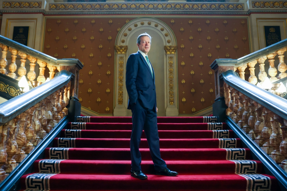 Photo of Nigel Casey standing on staircase