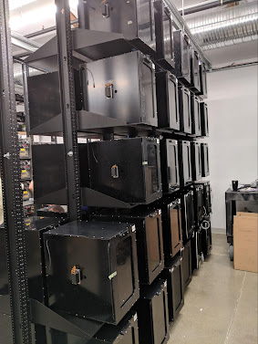 A single rack in our CameraX Test Lab on the left, and on the right, a moving image of the inside of a test inclusure with rotating phone mount