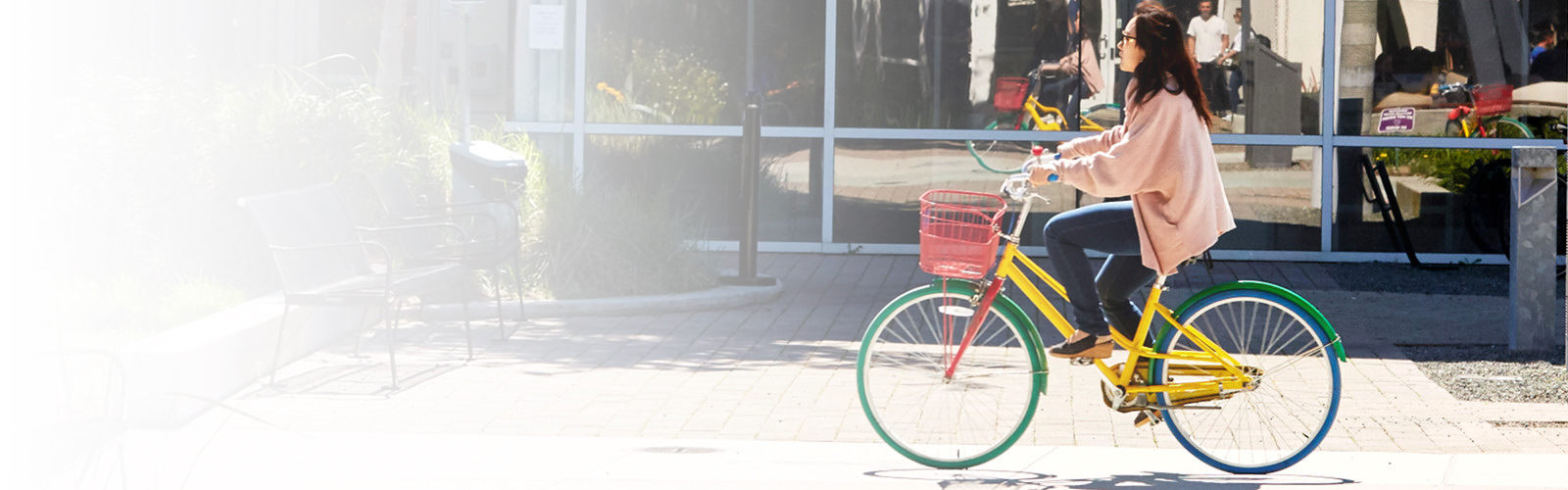 woman riding a bike on a city street