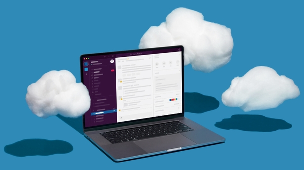Computer with Slack application opened and clouds hovering around