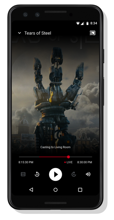 รูปภาพโทรศัพท์ Android กำลังเล่นวิดีโอ ข้อความ &quot;กำลังแคสต์ไปที่ห้องนั่งเล่น&quot; จะปรากฏที่ด้านล่างเหนือชุดตัวควบคุมวิดีโอเพลเยอร์