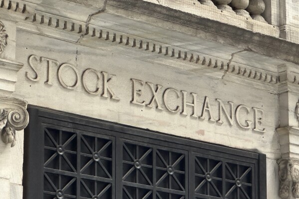 FILE - A sign at the New York Stock Exchange is shown on June 18, 2024 in New York. Global shares are mostly lower on Friday, June 21, 2024, after a retreat on Wall Street, where a drop in Nvidia stock pulled stocks lower. (AP Photo/Peter Morgan, File)