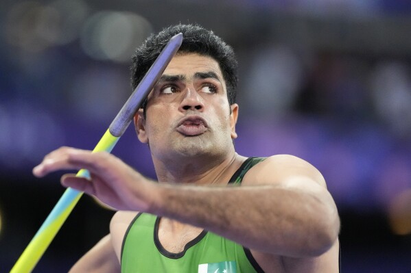 Arshad Nadeem, of Pakistan, competes during the men's javelin throw final at the 2024 Summer Olympics, Thursday, Aug. 8, 2024, in Saint-Denis, France. (AP Photo/Matthias Schrader)