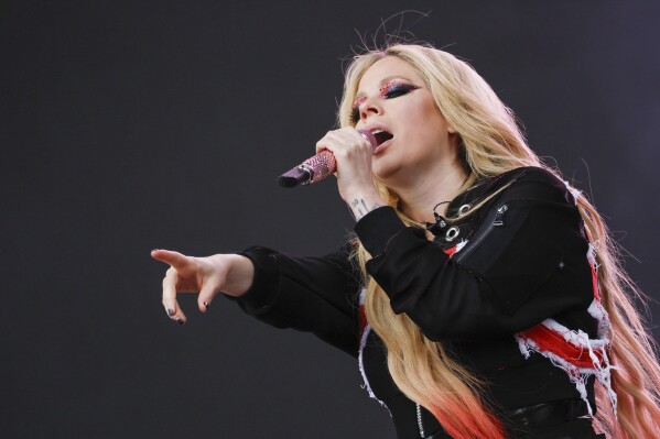 Avril Lavigne performs during the Glastonbury Festival in Worthy Farm, Somerset, England, Sunday, June 30, 2024. (Joel C Ryan/Invision/AP)
