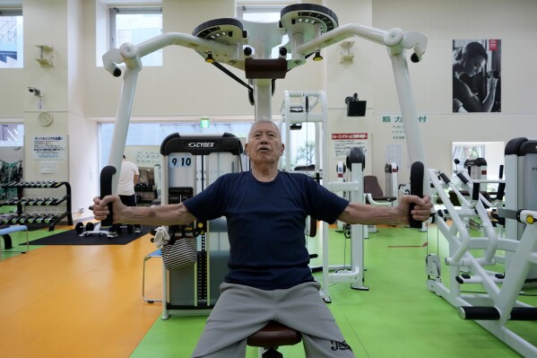 Shigeo Takahashi, 83, uses a pec deck machine as he works out at the Fukagawa Sports Center in Tokyo, Wednesday, June 12, 2024. If you are getting up there in years, weight-resistance training might deliver unexpected benefits. (AP Photo/Hiro Komae)