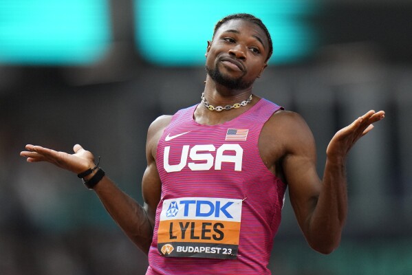 Noah Lyles, of the United States reacts after finishing a Men's 200-meters semifinal during the World Athletics Championships in Budapest, Hungary, Thursday, Aug. 24, 2023. (AP Photo/Petr David Josek)