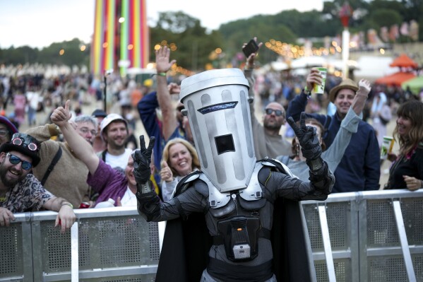 Count Binface, a candidate in Britain's upcoming general election, poses for photographers during the Glastonbury Festival in Worthy Farm, Somerset, England, Saturday, June 29, 2024. (Scott A Garfitt/Invision/AP)
