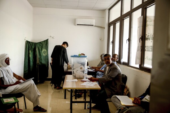 A man casts his ballot, during the presidential election, in Nouakchott, Mauritania, Saturday, June 29, 2024. Mauritanians are voting for their next president, with the incumbent Mohamed Ould Ghazouani widely expected to win the vote after positioning Mauritania as a strategic ally of the West in a region swept by coups and violence. (AP Photo/Mamsy Elkeihel)