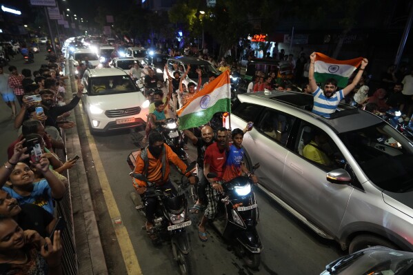 Cricket fans throng on streets to celebrate after India won the ICC Men's T20 World Cup final match against South Africa played at Barbados, in Ahmedabad, India, Sunday, June 30, 2024. (AP Photo/Ajit Solanki)