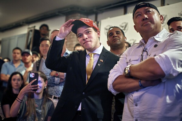 Trump supporter, Lucas Federico, 21 years old, from New York, center, watches the debate during the Young Republicans' Presidential debate watch party, June 27, 2024, in New York as President Joe Biden faces former President Donald Trump during the first Presidential debate ahead of the 2024 elections. (AP Photo/Andres Kudacki)