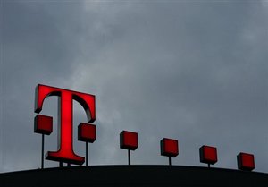 ** FILE ** A Feb. 28, 2008 file photo shows dark clouds above the logo of Deutsche Telekom at the German telecommunication company's headquarters headquarters in Bonn, western Germany.