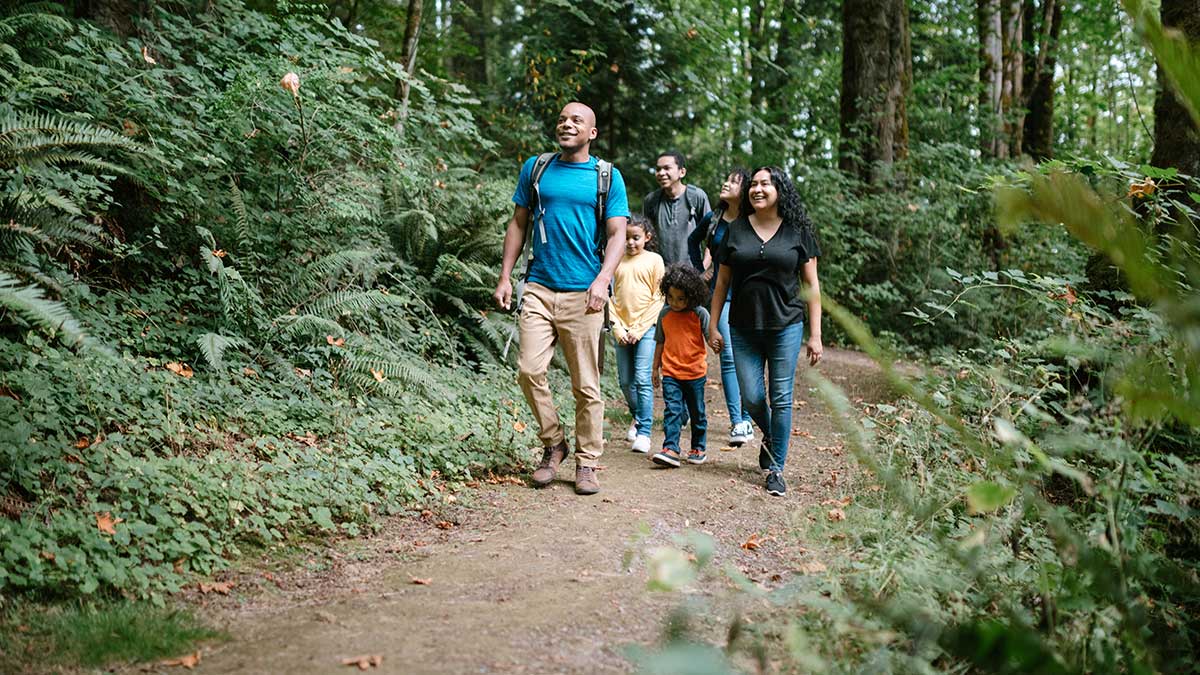 Family hiking in woods