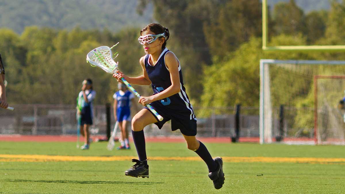 Child playing lacrosse